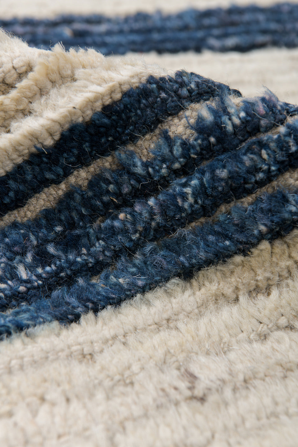 9' x 12' one-of-a-kind handmade vintage Tulu large size rug. Color palette: ivory, indigo, charcoal, black, purple, gray