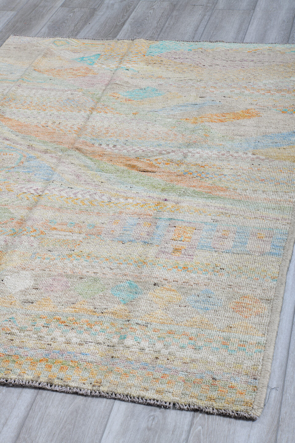4' x 6' one-of-a-kind handmade vintage Tulu small size rug. Color palette: ivory, pale aqua, apricot, sage, lavender, taupe