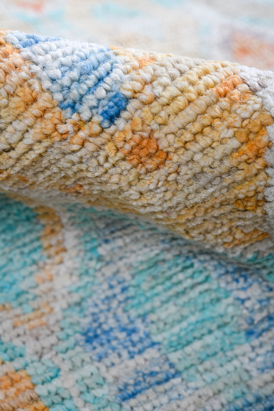 5' x 6' one-of-a-kind handmade vintage Tulu rug. Color palette: ivory, aqua, coral, saffron, lavender, pale blue, taupe