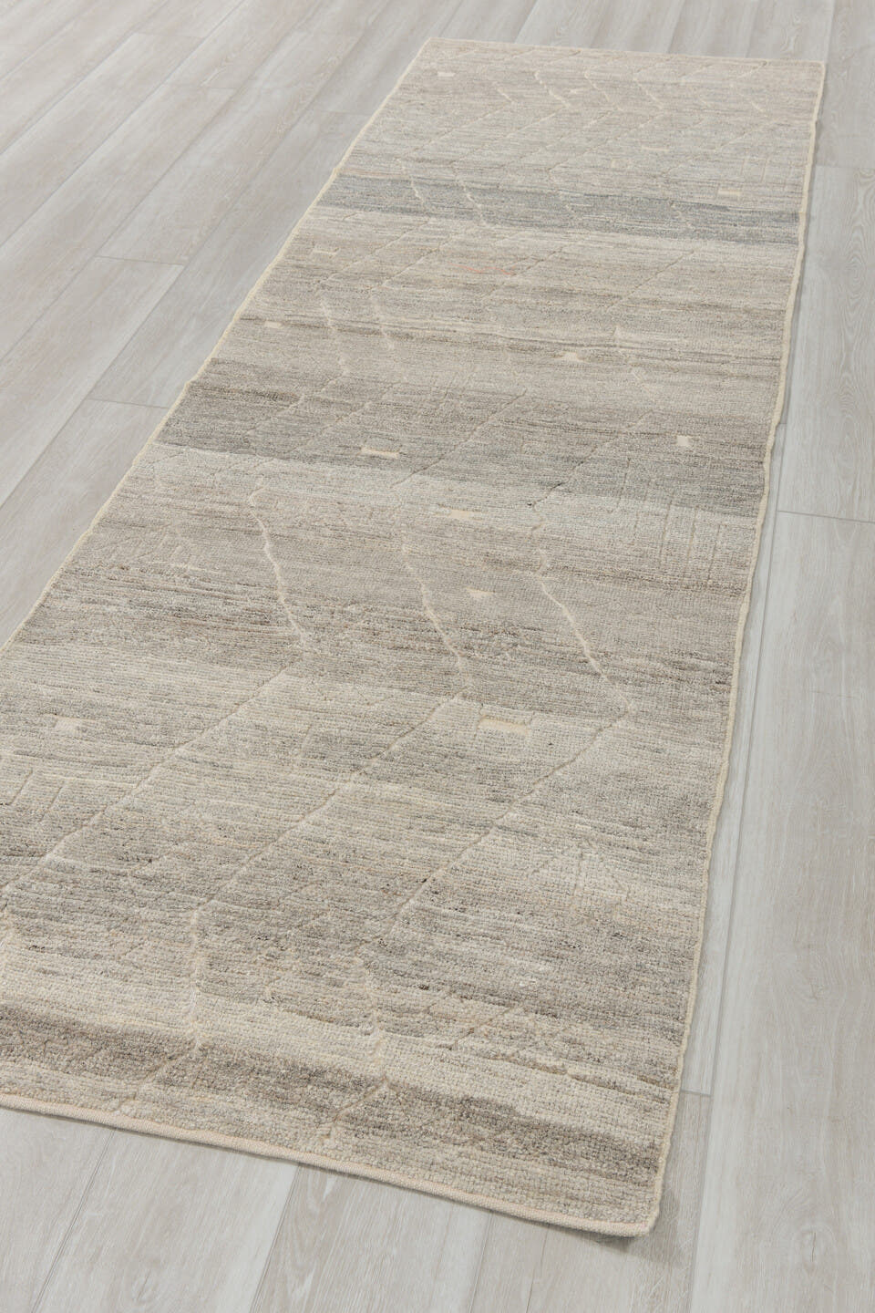 3' x 9' one-of-a-kind handmade vintage Tulu runner rug. Color palette: gray, ivory, taupe, cream, charcoal, beige, black