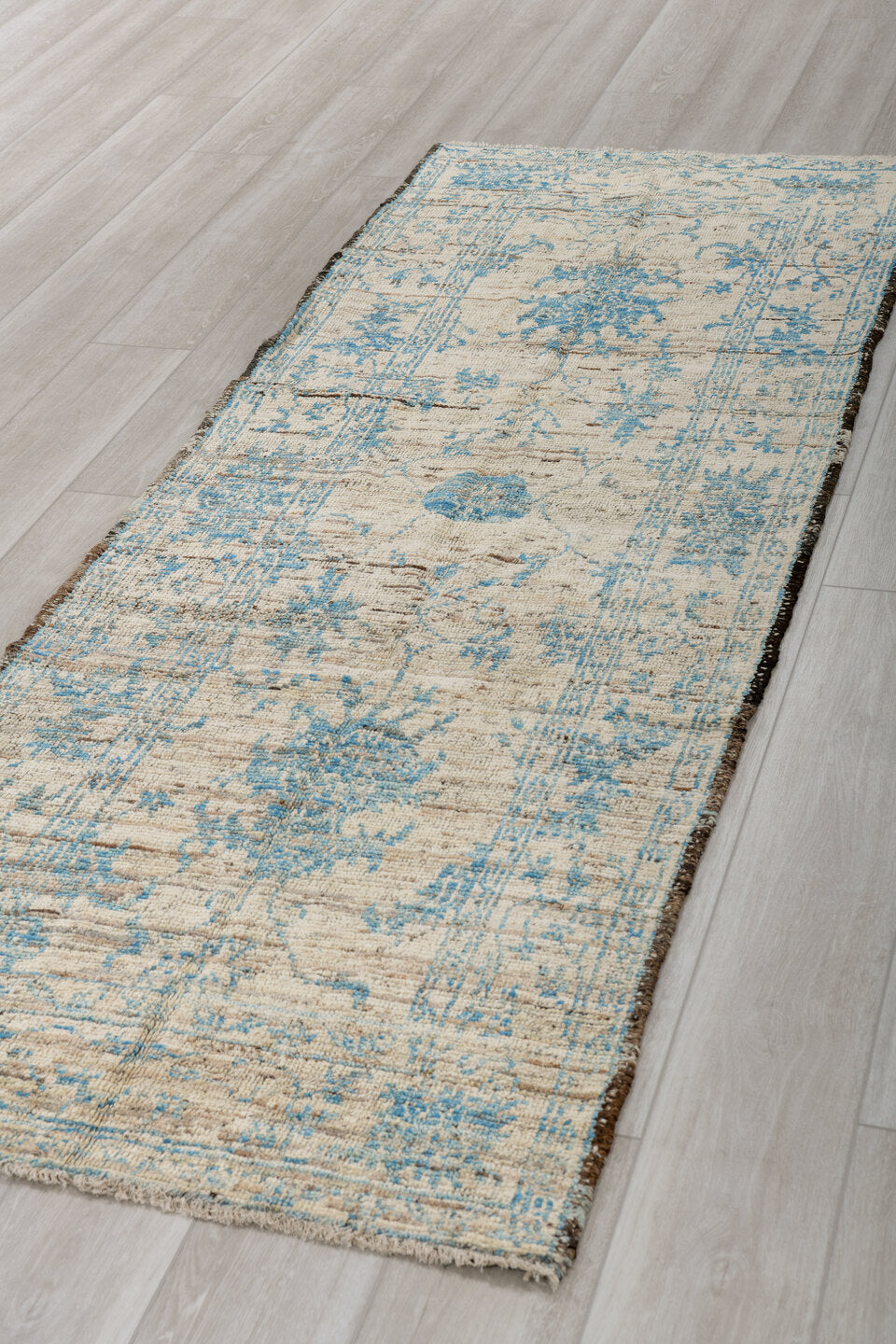 3' x 8' one-of-a-kind handmade vintage Tulu runner rug. Color palette: ivory, sky blue, charcoal, taupe, light blue, gray