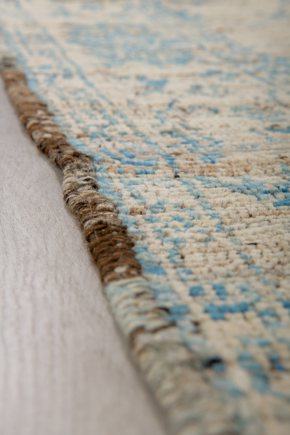 3' x 8' one-of-a-kind handmade vintage Tulu runner rug. Color palette: ivory, sky blue, charcoal, taupe, light blue, gray