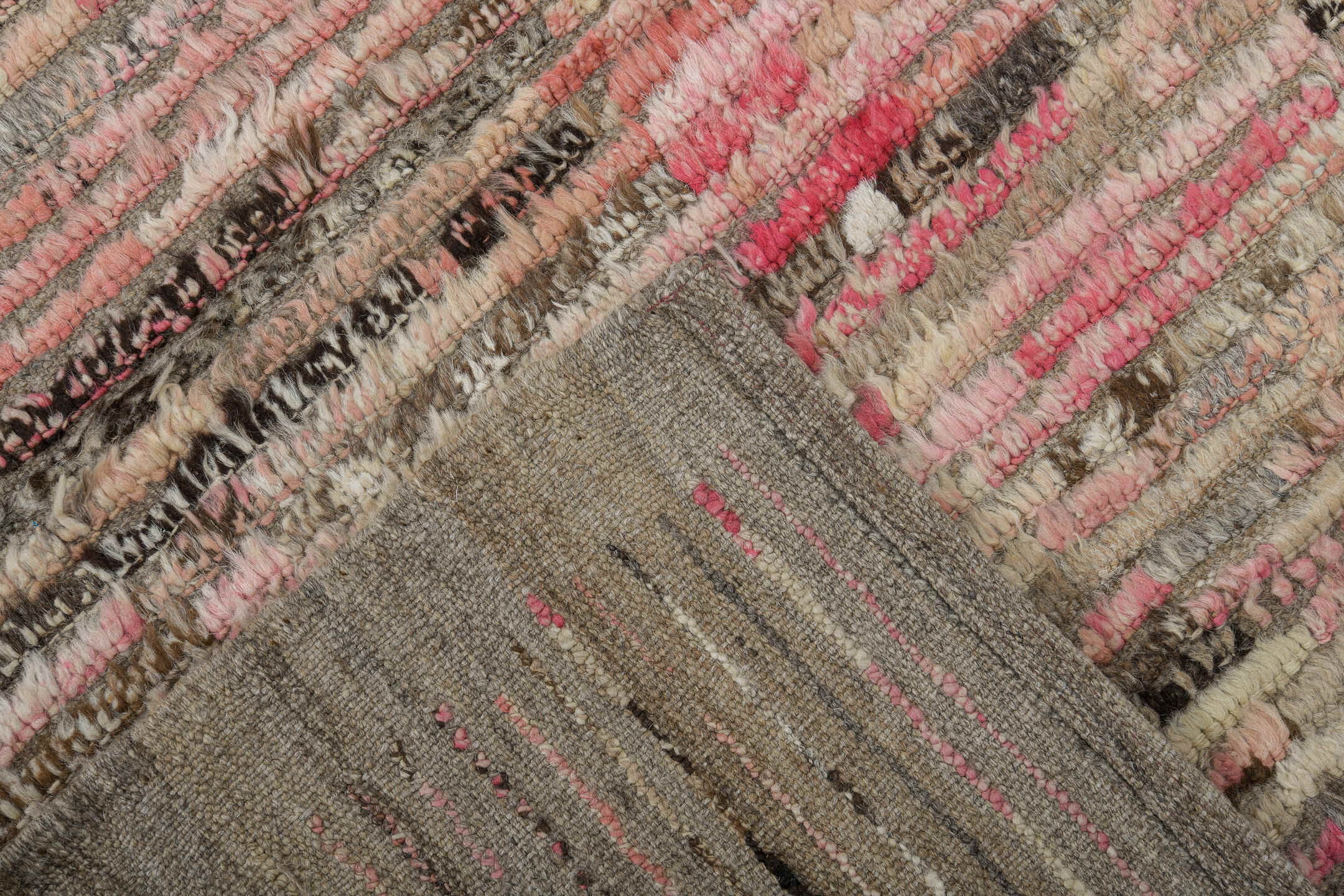 3' x 9' one-of-a-kind handmade vintage Tulu runner rug. Color palette: brown, gray, light gray, off-white, pink, red