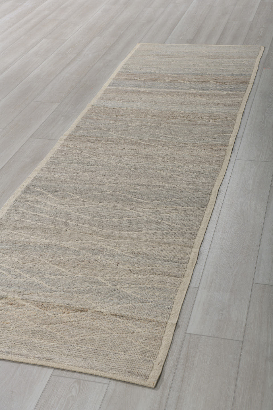 3' x 10' one-of-a-kind handmade vintage Tulu runner rug. Color palette: taupe, ivory, gray, cream, greige, beige