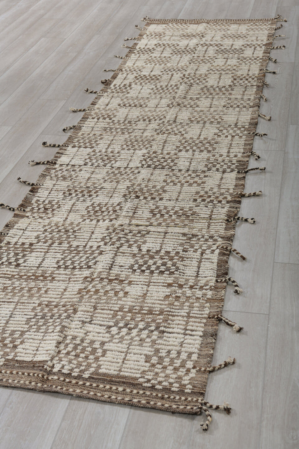 3' x 12' one-of-a-kind handmade vintage Tulu runner rug. Color palette: ivory, brown, taupe, camel, beige, gray