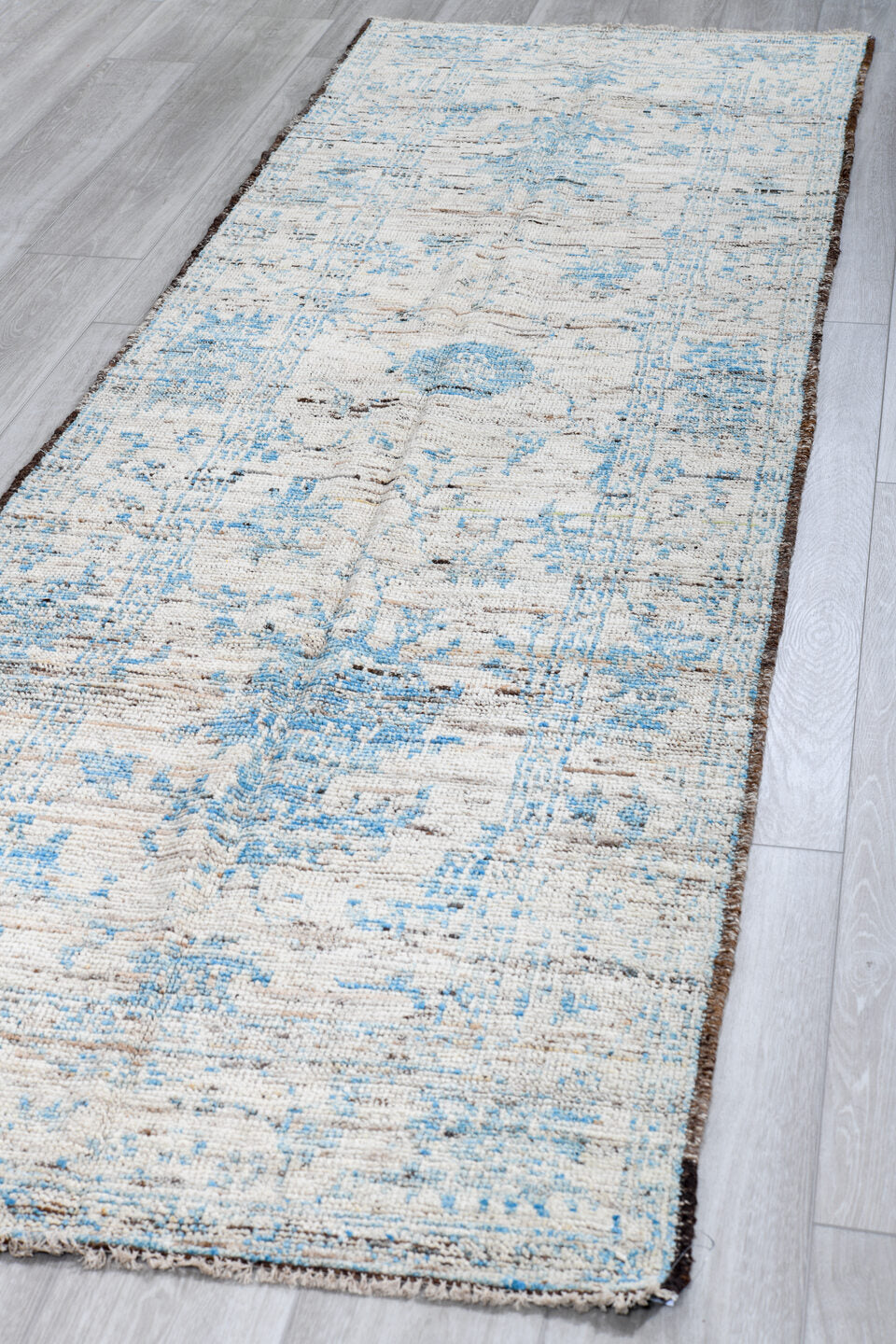 3' x 10' one-of-a-kind handmade vintage Tulu runner rug. Color palette: ivory, sky blue, taupe, beige, brown, light blue