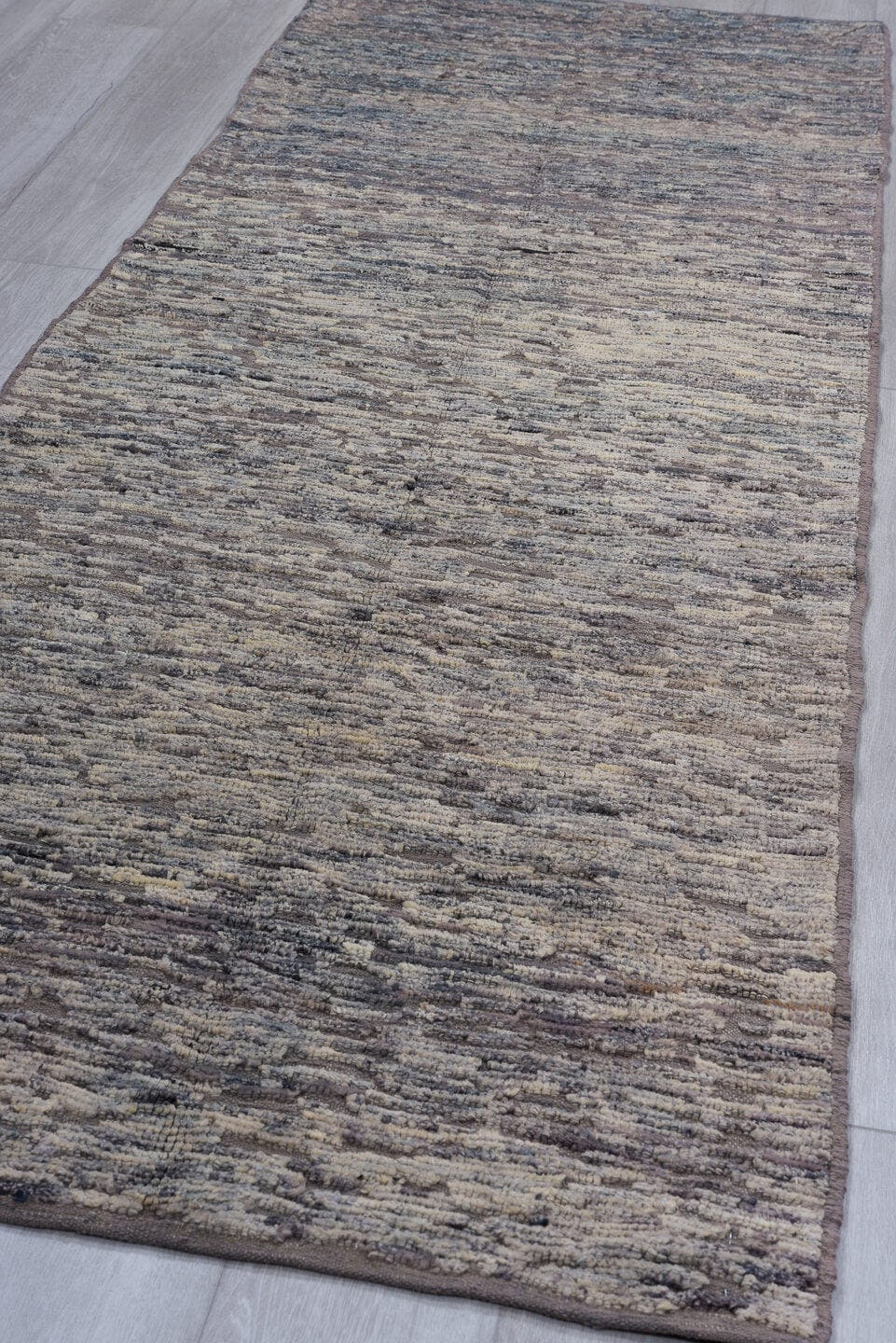 3' x 9' one-of-a-kind handmade vintage Tulu runner rug. Color palette: gray, taupe, charcoal, ivory, beige, black