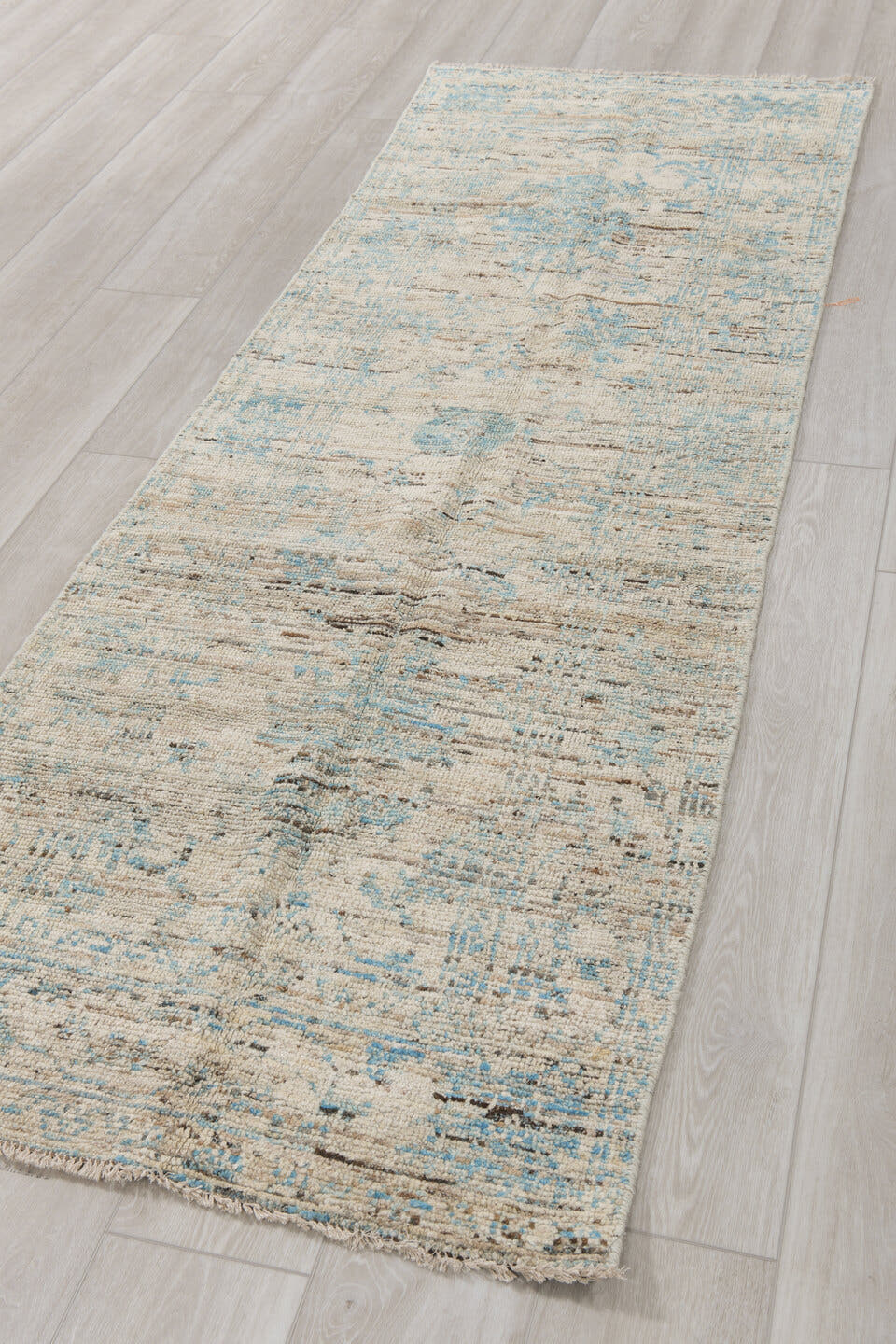2' x 8' one-of-a-kind handmade vintage Tulu runner rug. Color palette: ivory, pale blue, sky blue, taupe, gray, light blue
