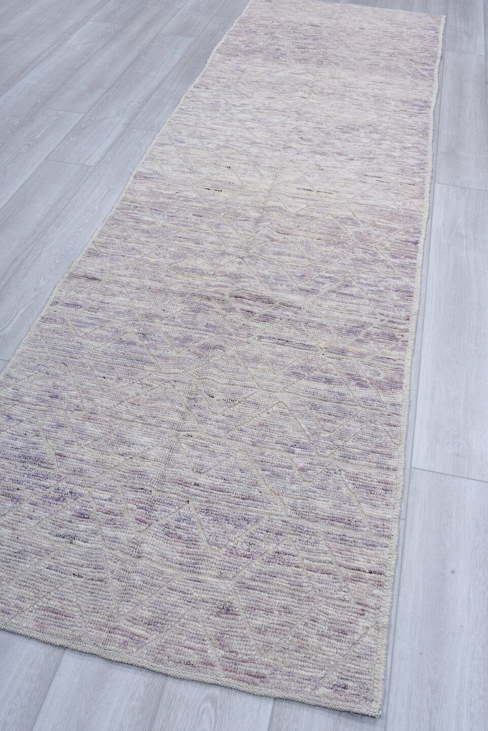 3' x 11' one-of-a-kind handmade vintage Tulu runner rug. Color palette: ivory, taupe, lavender, gray, greige, beige
