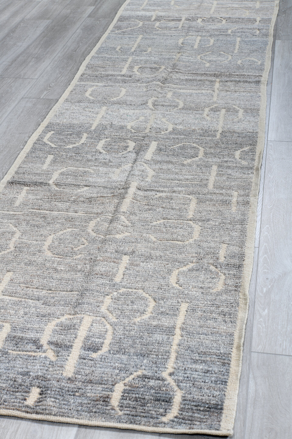 3' x 11' one-of-a-kind handmade vintage Tulu runner rug. Color palette: gray, ivory, charcoal, slate, black