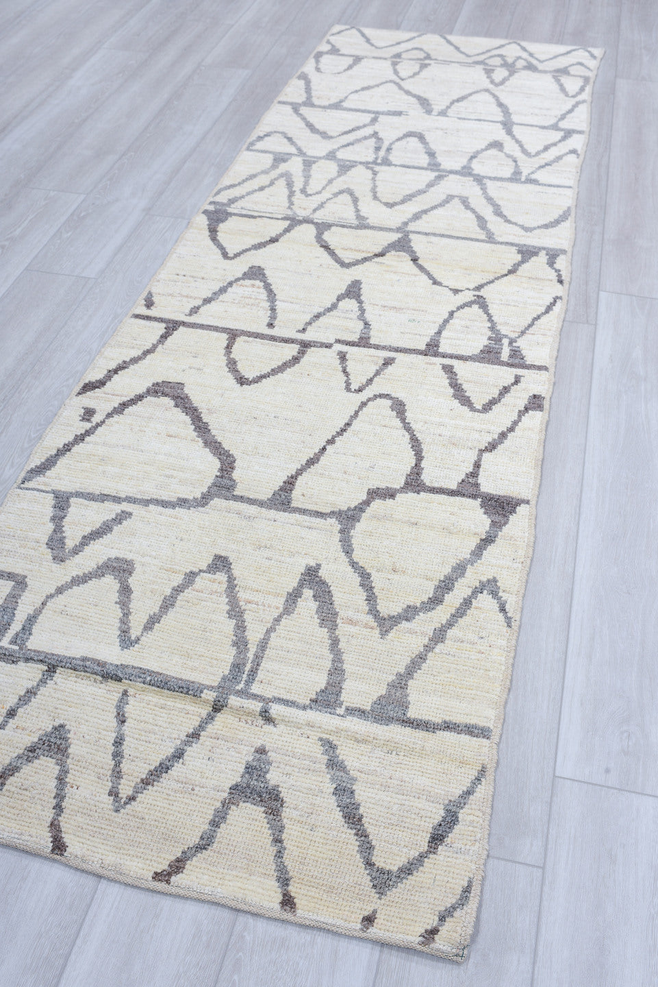 3' x 9' one-of-a-kind handmade vintage Tulu runner rug. Color palette: ivory, charcoal, gray, black