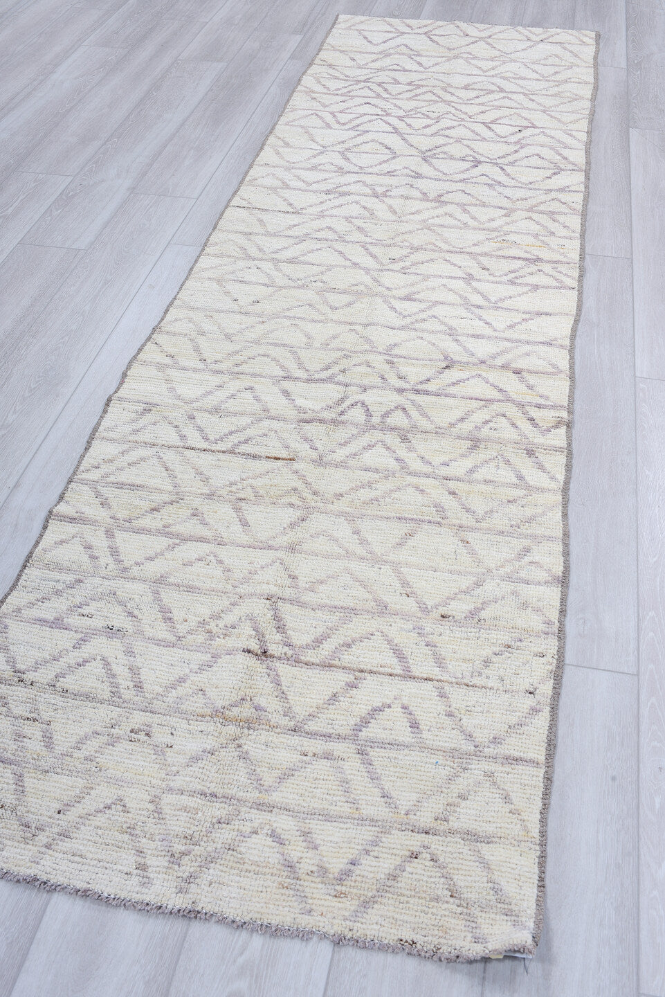 3' x 10' one-of-a-kind handmade vintage Tulu runner rug. Color palette: ivory, taupe, gray, cream, beige
