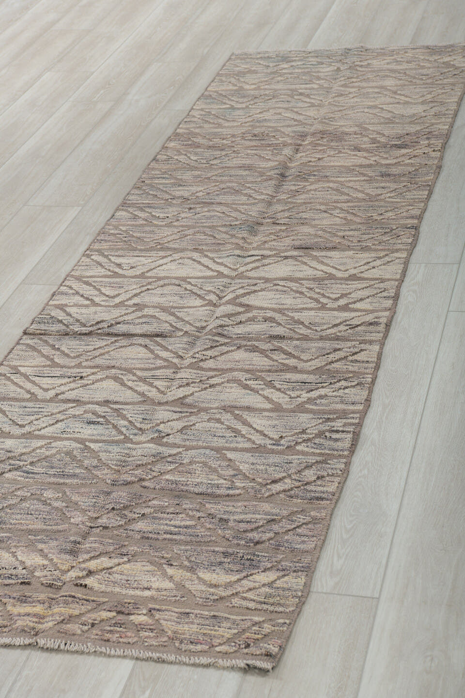 2' x 10' one-of-a-kind handmade vintage Tulu runner rug. Color palette: taupe, ivory, charcoal, gray, beige, black