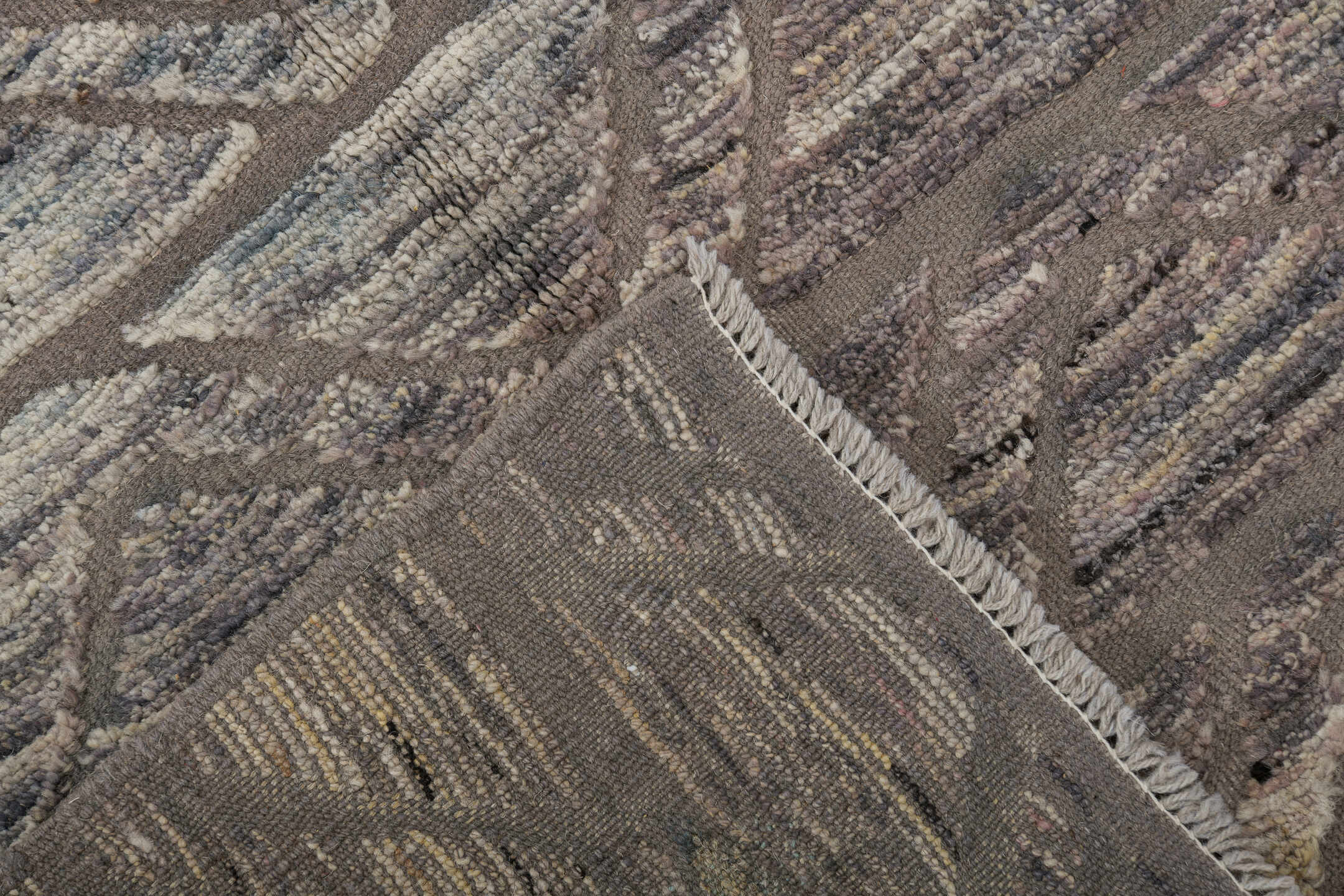 2' x 10' one-of-a-kind handmade vintage Tulu runner rug. Color palette: black, dark gray, gray, light gray, off-white, pink