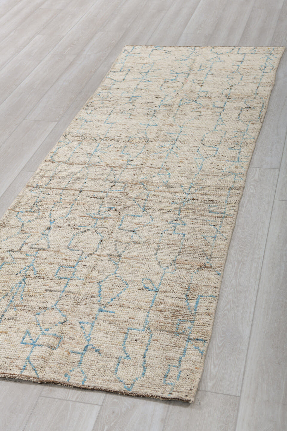 3' x 8' one-of-a-kind handmade vintage Tulu runner rug. Color palette: ivory, sky blue, taupe, brown, cream, light blue