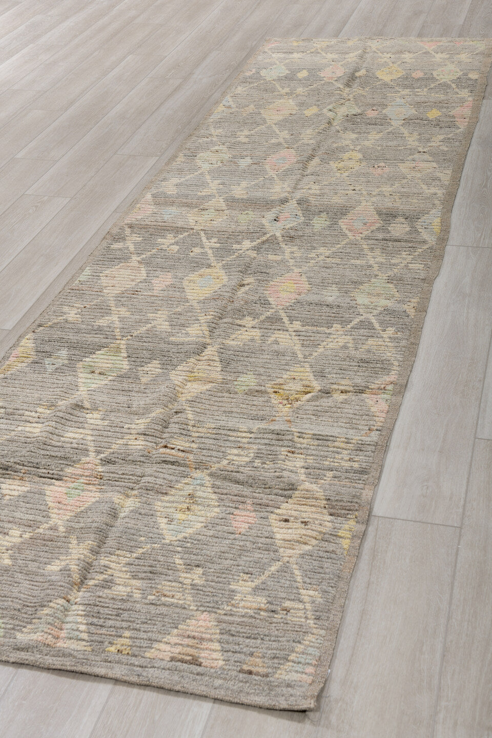 3' x 12' one-of-a-kind handmade vintage Tulu runner rug. Color palette: gray, ivory, cream, pale yellow, blush, sage, gold