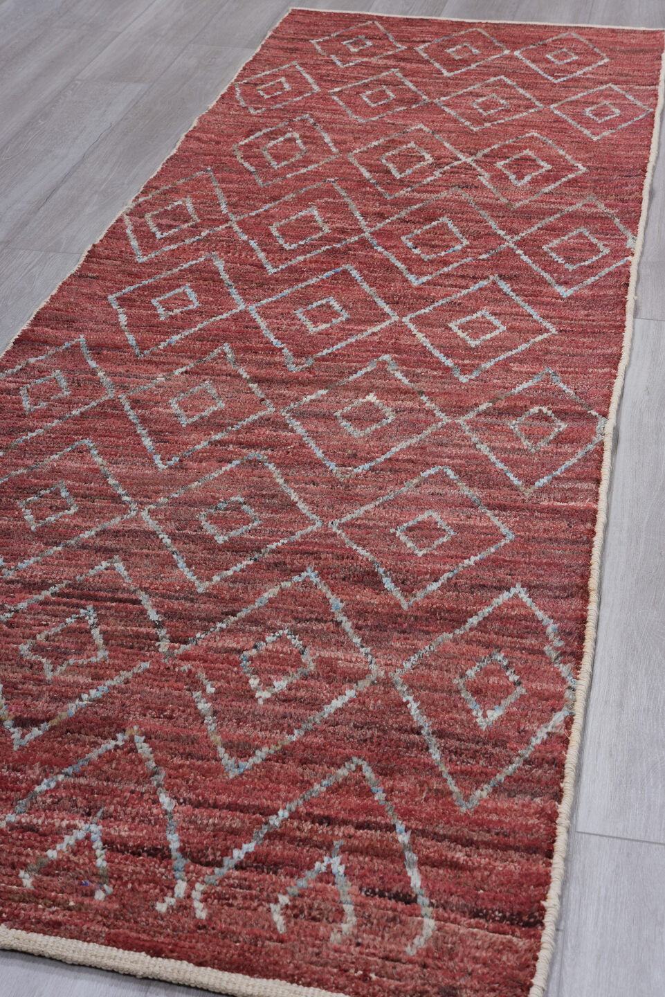 3' x 10' one-of-a-kind handmade vintage Tulu runner rug. Color palette: brown, gray, light blue, light coral, light gray
