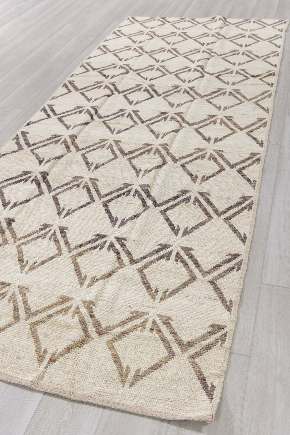 4' x 11' one-of-a-kind handmade vintage Tulu runner rug. Color palette: ivory, charcoal, taupe, black, gray, beige