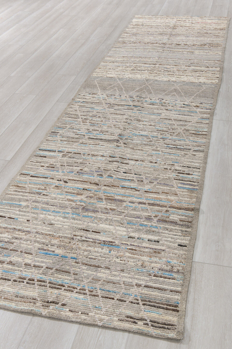 3' x 12' one-of-a-kind handmade vintage Tulu runner rug. Color palette: gray, ivory, taupe, charcoal, sky blue, brown, beige