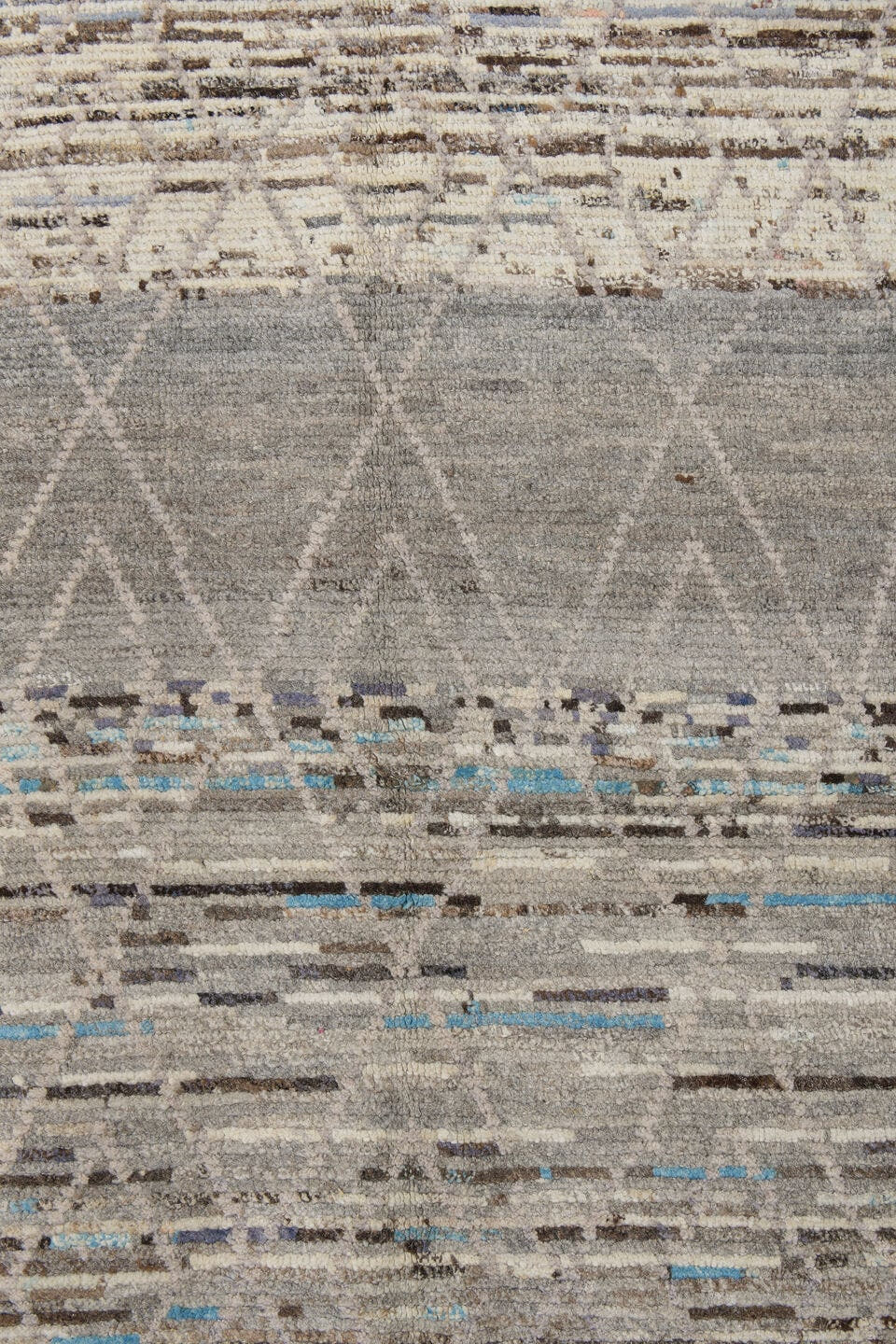 3' x 12' one-of-a-kind handmade vintage Tulu runner rug. Color palette: gray, ivory, taupe, charcoal, sky blue, brown, beige