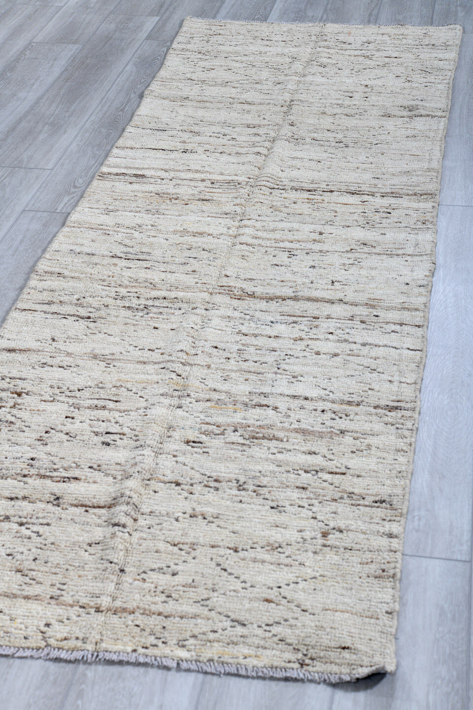 2' x 9' one-of-a-kind handmade vintage Tulu runner rug. Color palette: ivory, taupe, brown, gray, beige