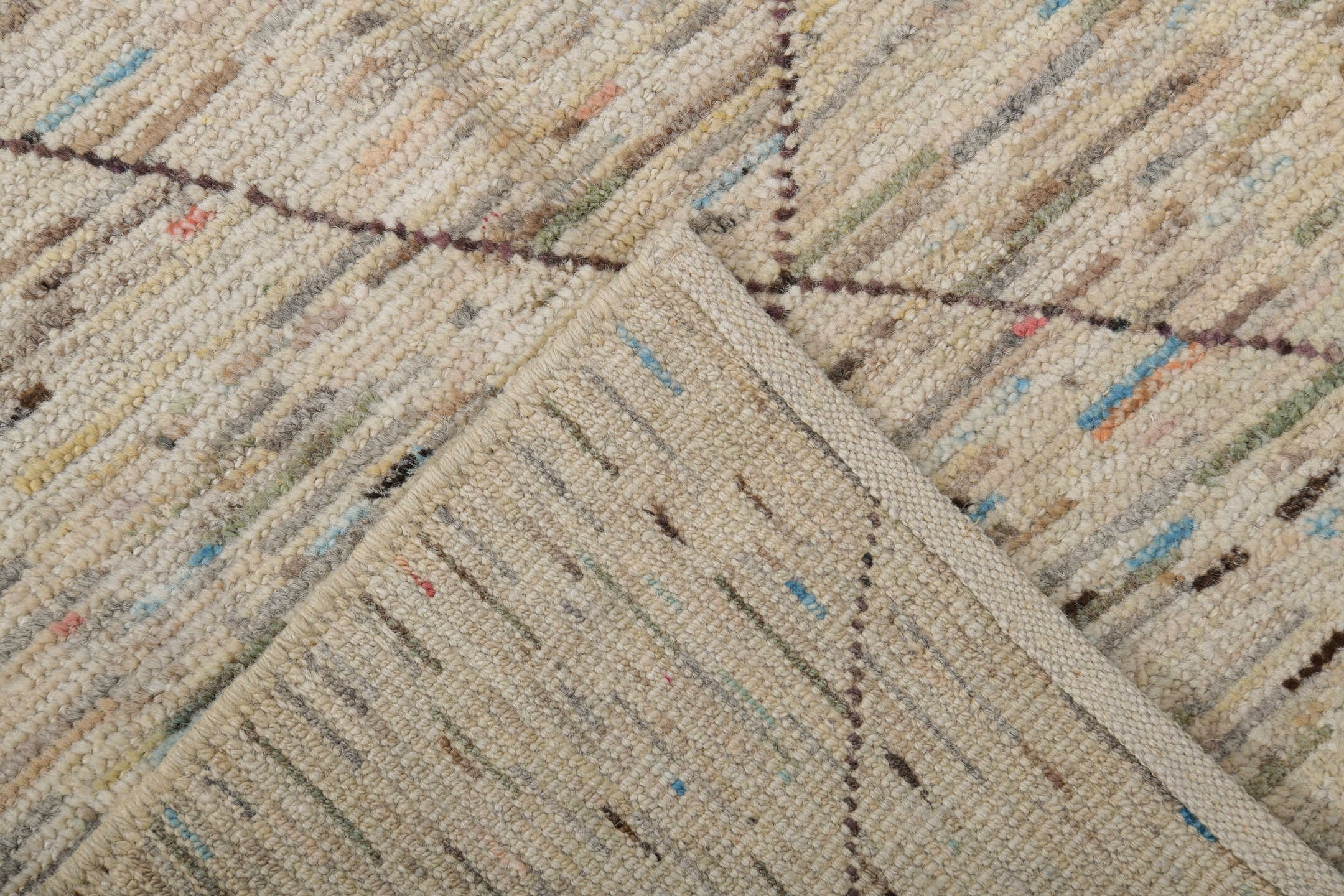 2' x 10' one-of-a-kind handmade vintage Tulu runner rug. Color palette: ivory, taupe, charcoal, camel, slate, sky_blue