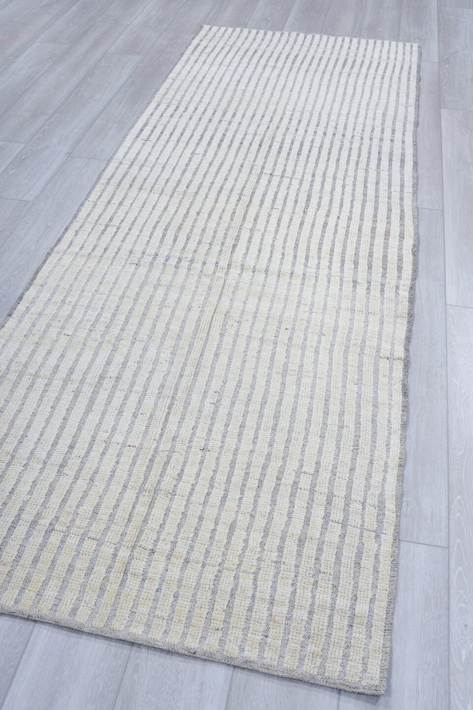3' x 9' one-of-a-kind handmade vintage Tulu runner rug. Color palette: ivory, pale blue, light gray, light blue