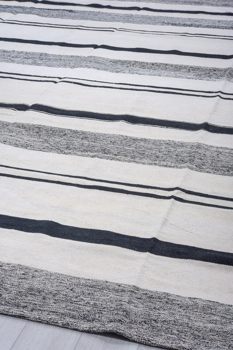 11' x 15' one-of-a-kind handmade vintage Tulu oversize rug. Color palette: ivory, charcoal, black, gray