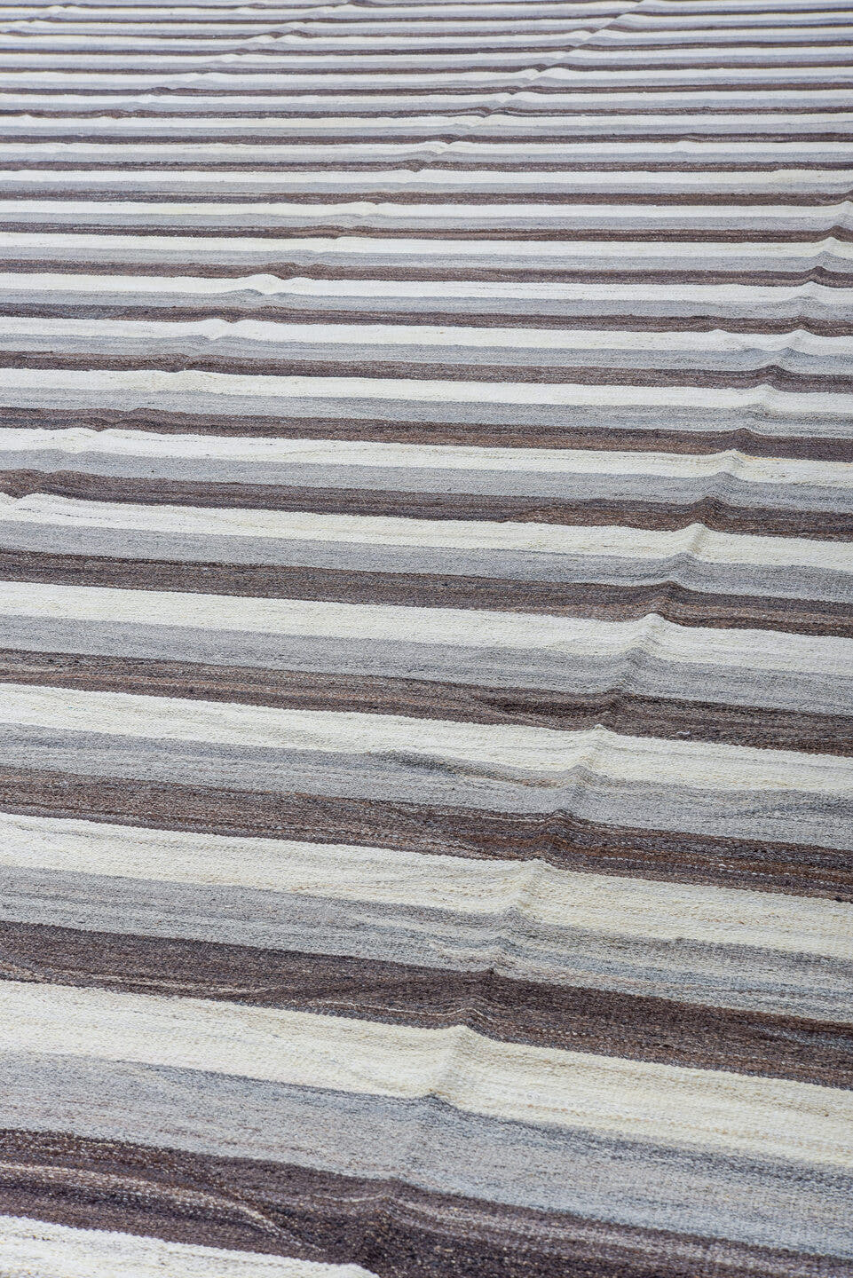 14' x 20' one-of-a-kind handmade vintage Tulu oversize rug. Color palette: ivory, taupe, brown, gray, charcoal, beige, black