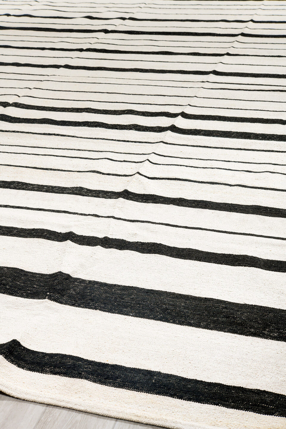 14' x 18' one-of-a-kind handmade vintage Tulu oversize rug. Color palette: ivory, charcoal, gray, black