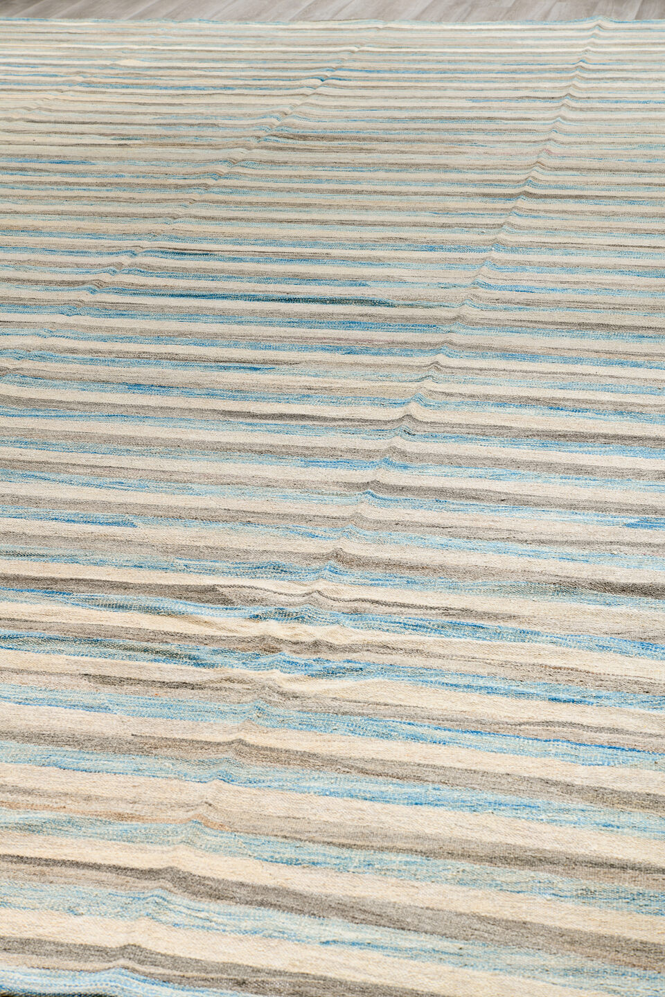 14' x 19' one-of-a-kind handmade vintage Tulu oversize rug. Color palette: ivory, pale blue, taupe, cream, gray, light blue
