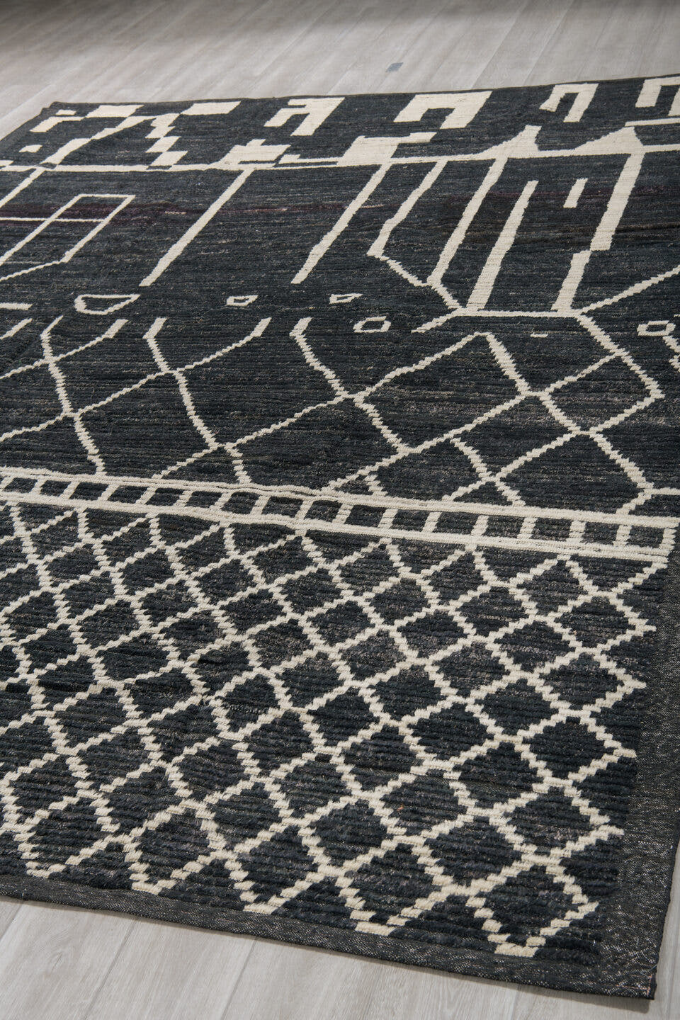 9' x 12' one-of-a-kind handmade vintage Tulu large size rug. Color palette: charcoal, ivory, slate, ebony, gray, black