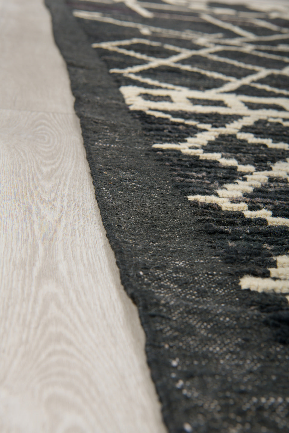 9' x 12' one-of-a-kind handmade vintage Tulu large size rug. Color palette: charcoal, ivory, slate, ebony, gray, black