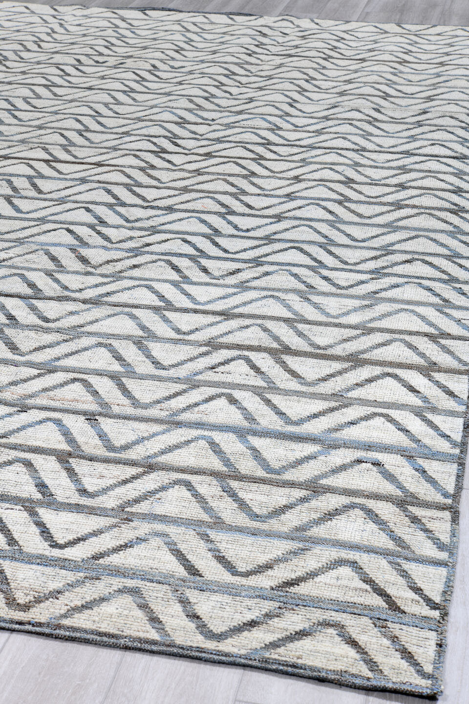 9' x 13' one-of-a-kind handmade vintage Tulu large size rug. Color palette: ivory, slate, blue, charcoal, gray, black