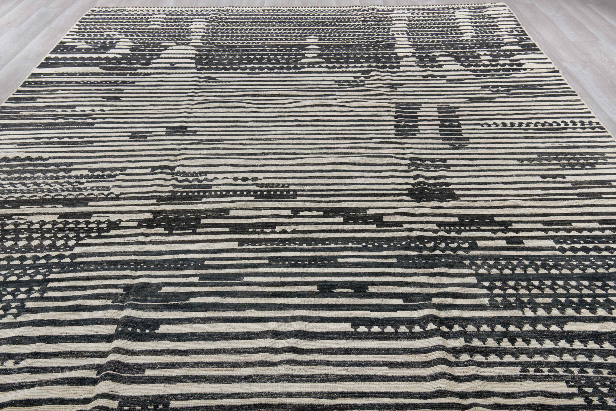 10' x 13' one-of-a-kind handmade vintage Tulu large size rug. Color palette: black, blue, brown, charcoal, dark gray