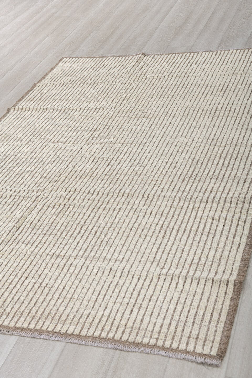 5' x 8' one-of-a-kind handmade vintage Tulu medium size rug. Color palette: ivory, taupe, brown, cream, beige, gray
