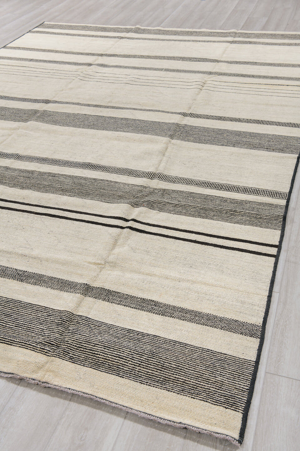 8' x 12' one-of-a-kind handmade vintage Tulu large size rug. Color palette: ivory, charcoal, cream, taupe, black, gray