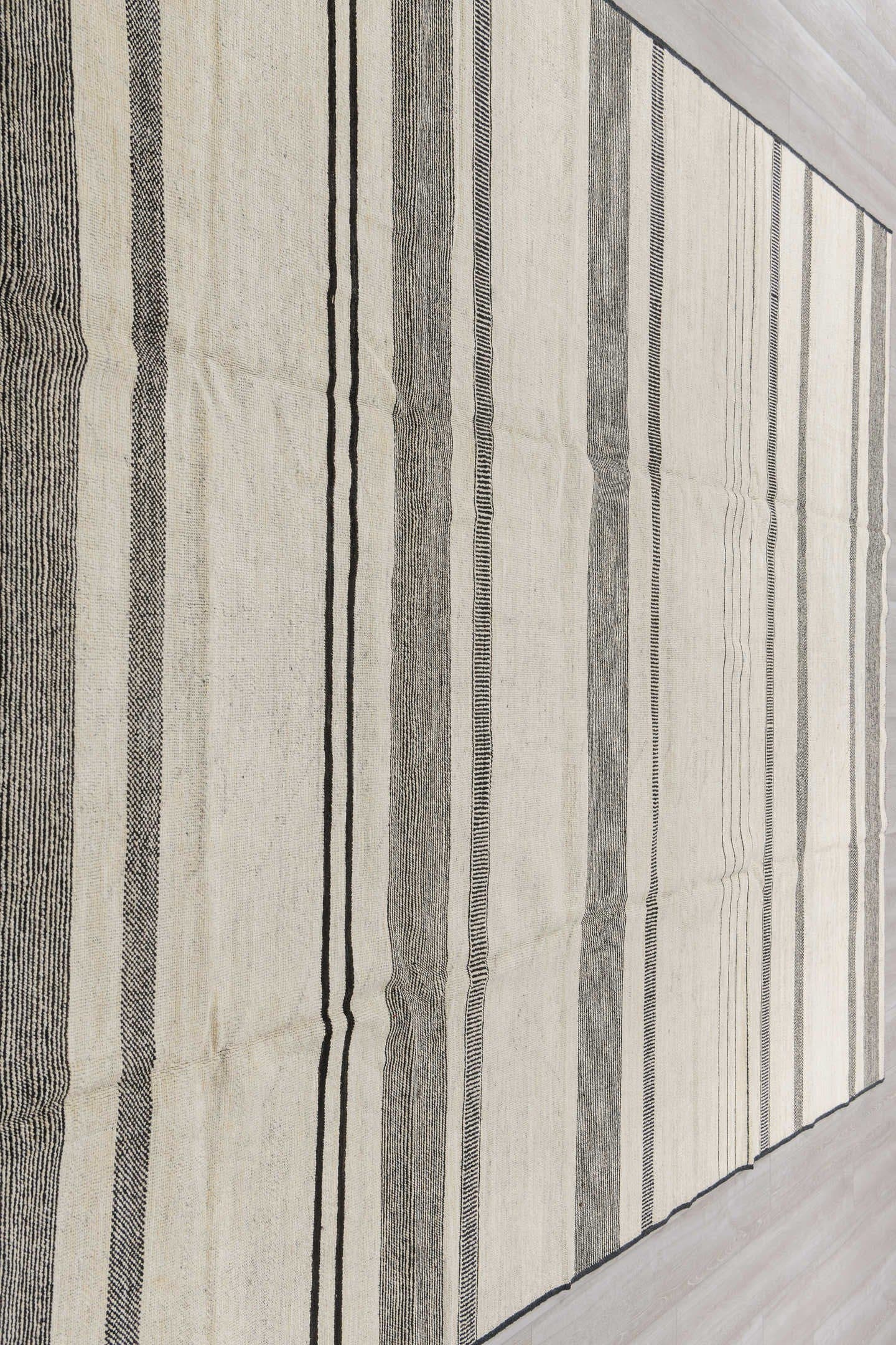 8' x 12' one-of-a-kind handmade vintage Tulu large size rug. Color palette: ivory, charcoal, cream, taupe, black, gray