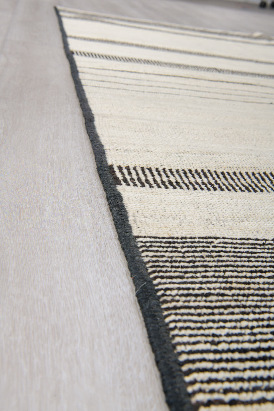 8' x 12' one-of-a-kind handmade vintage Tulu large size rug. Color palette: ivory, charcoal, cream, taupe, black, gray