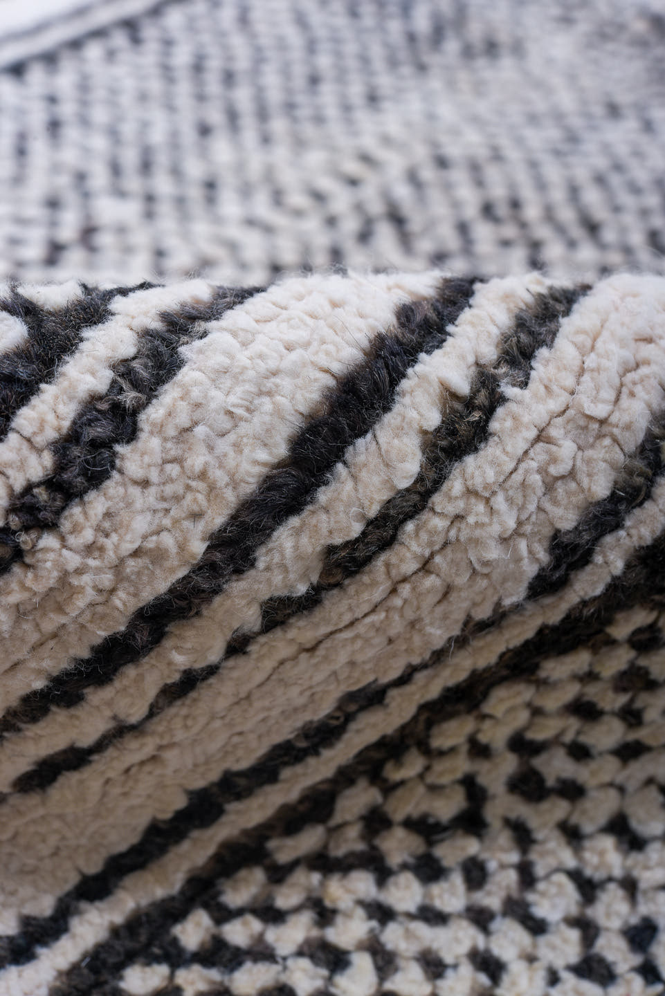 6' x 9' one-of-a-kind handmade vintage Tulu medium size rug. Color palette: ivory, charcoal, gray, black