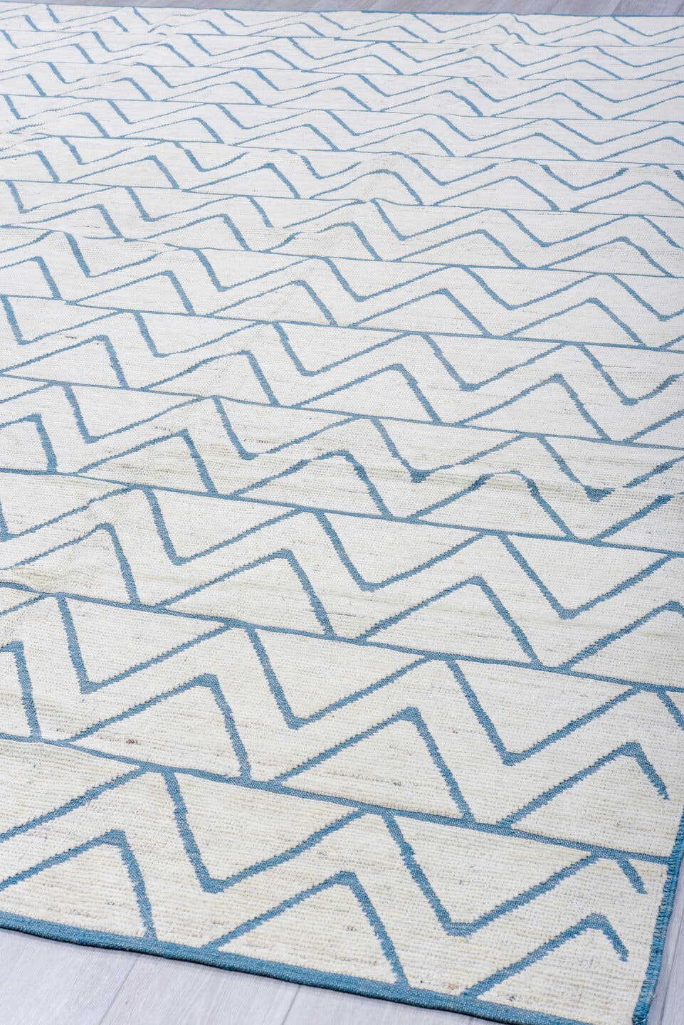9' x 12' one-of-a-kind handmade vintage Tulu large size rug. Color palette: ivory, sky_blue, pale_blue, light blue