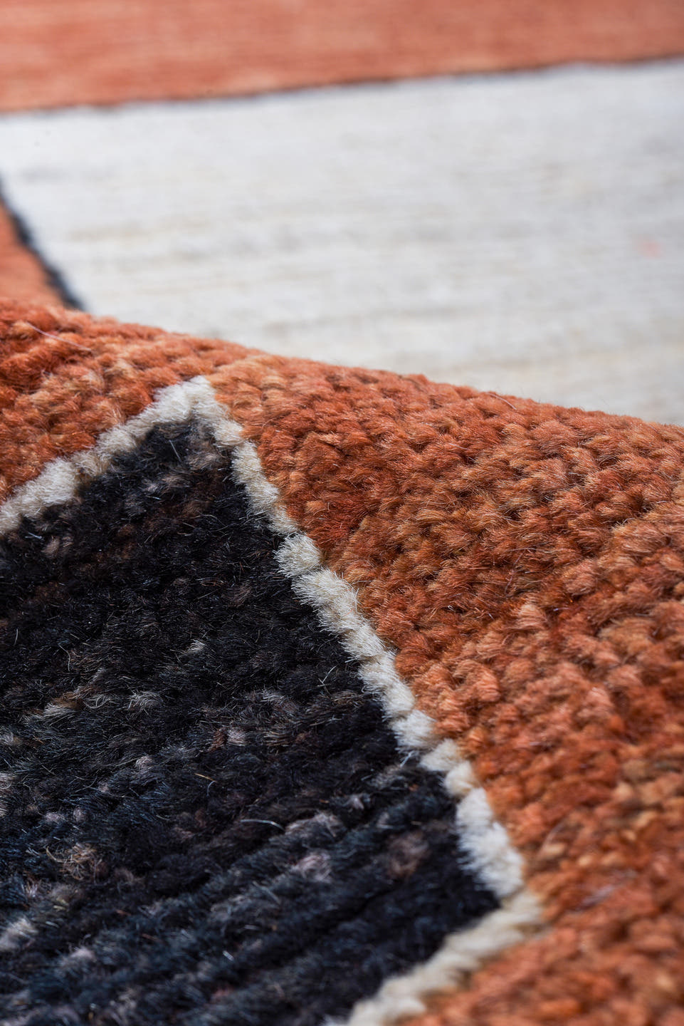 8' x 10' one-of-a-kind handmade vintage Tulu large size rug. Color palette: terra cotta, ivory, charcoal, rust, terracotta