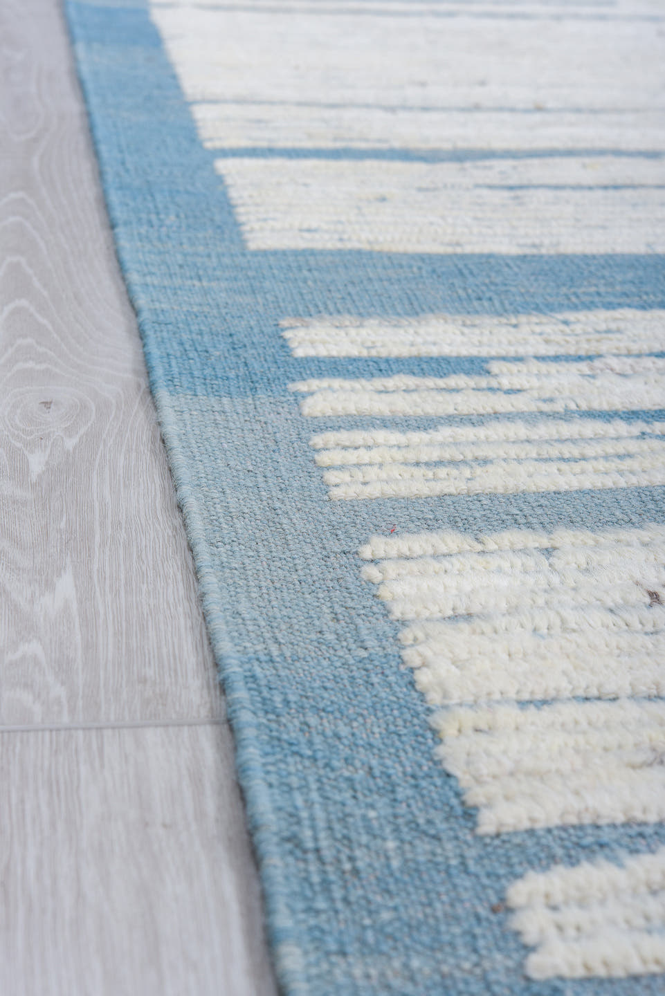 9' x 12' one-of-a-kind handmade vintage Tulu large size rug. Color palette: ivory, sky blue, slate, light blue, gray