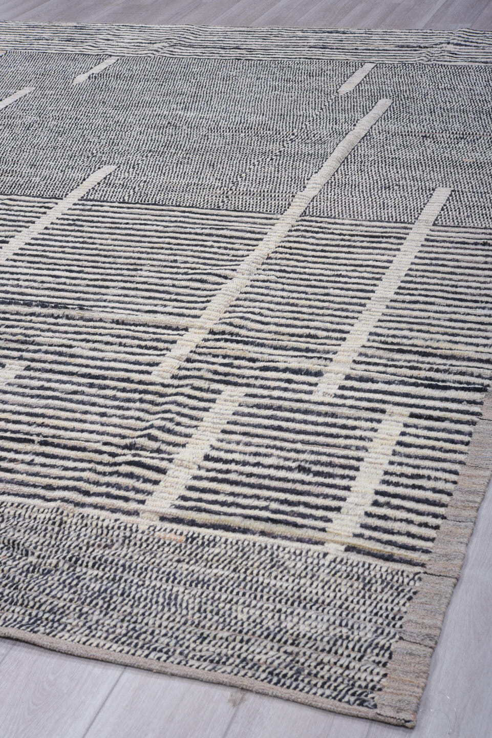 9' x 12' one-of-a-kind handmade vintage Tulu large size rug. Color palette: charcoal, ivory, gray, black