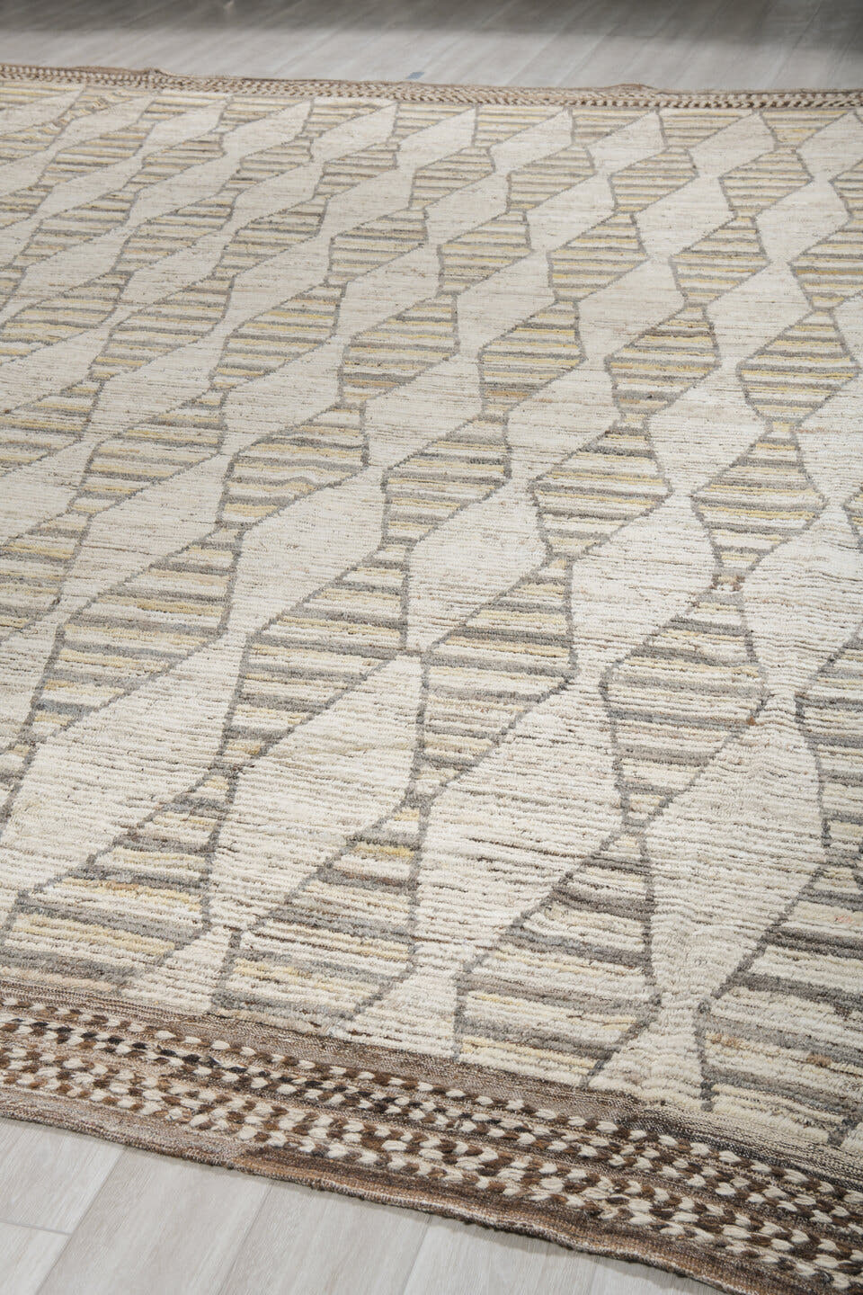 13' x 16' one-of-a-kind handmade vintage Tulu oversize rug. Color palette: ivory, taupe, brown, pale gold, charcoal, beige