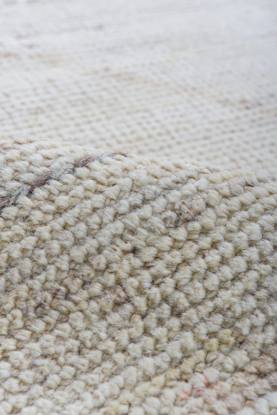 10' x 14' one-of-a-kind handmade vintage Tulu large size rug. Color palette: ivory, taupe, apricot, pale blue, butter yellow