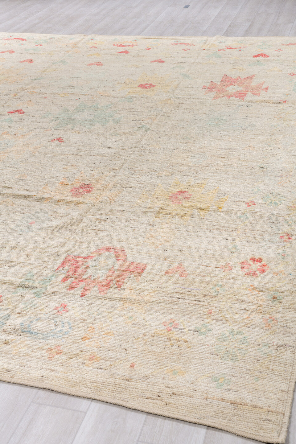 10' x 13' one-of-a-kind handmade vintage Tulu large size rug. Color palette: ivory, blush, pale sage, saffron, beige, pink