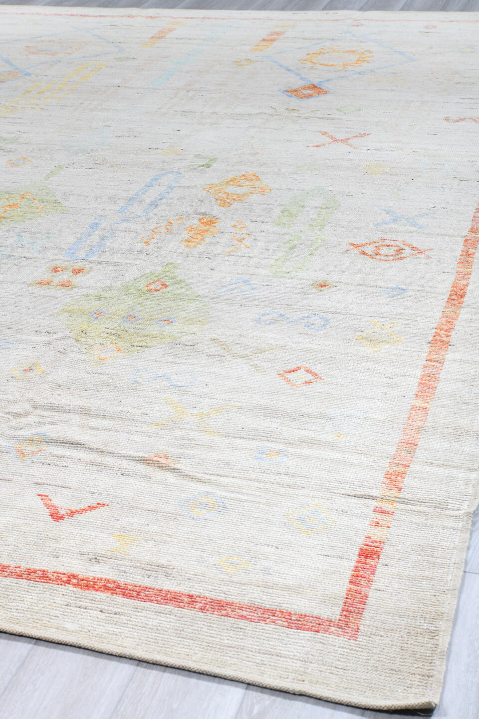 10' x 13' one-of-a-kind handmade vintage Tulu large size rug. Color palette: ivory, coral, sky_blue, pale_blue, soft_yellow