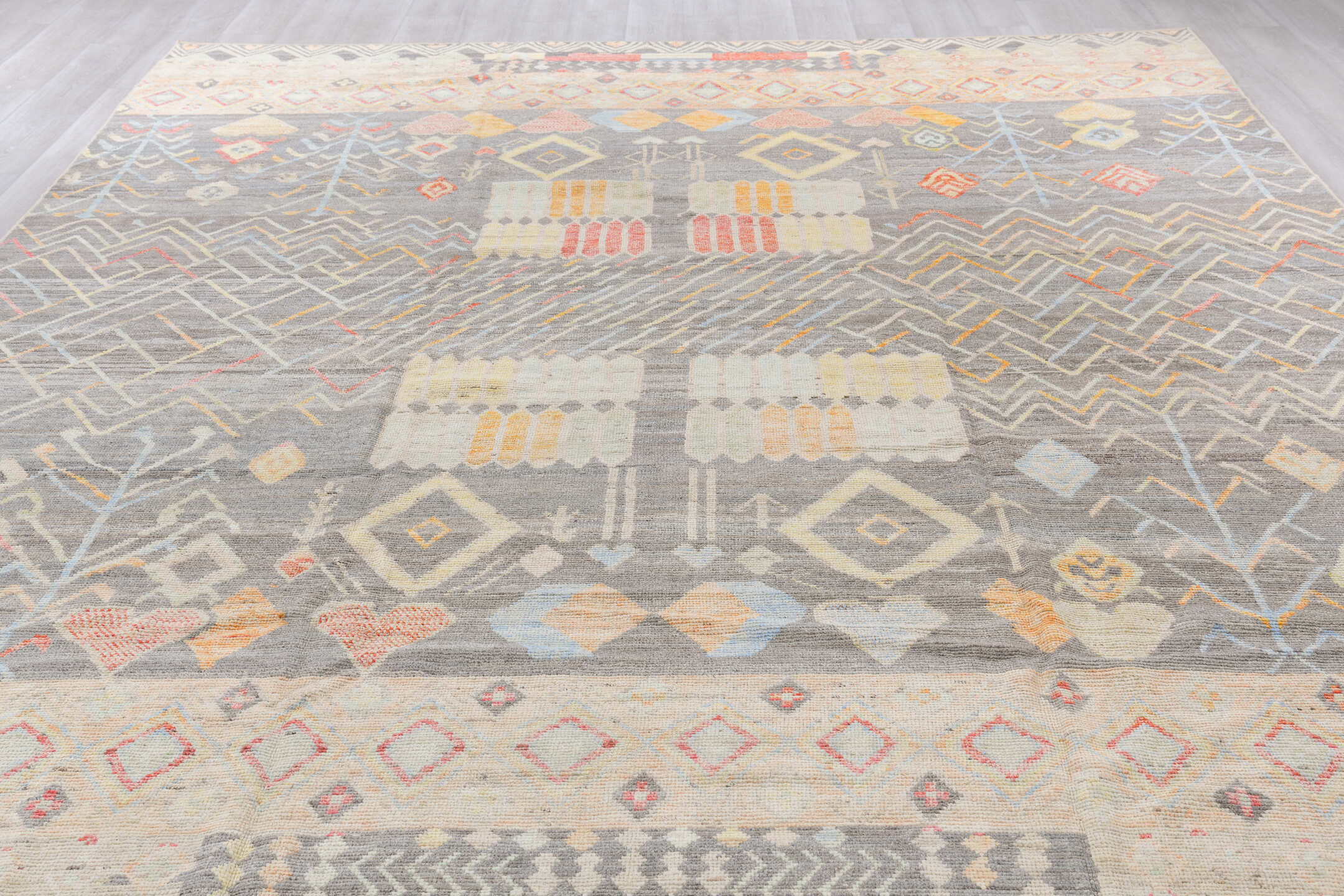 10' x 13' one-of-a-kind handmade vintage Tulu large size rug. Color palette: brown, gray, light gray, off-white, pink