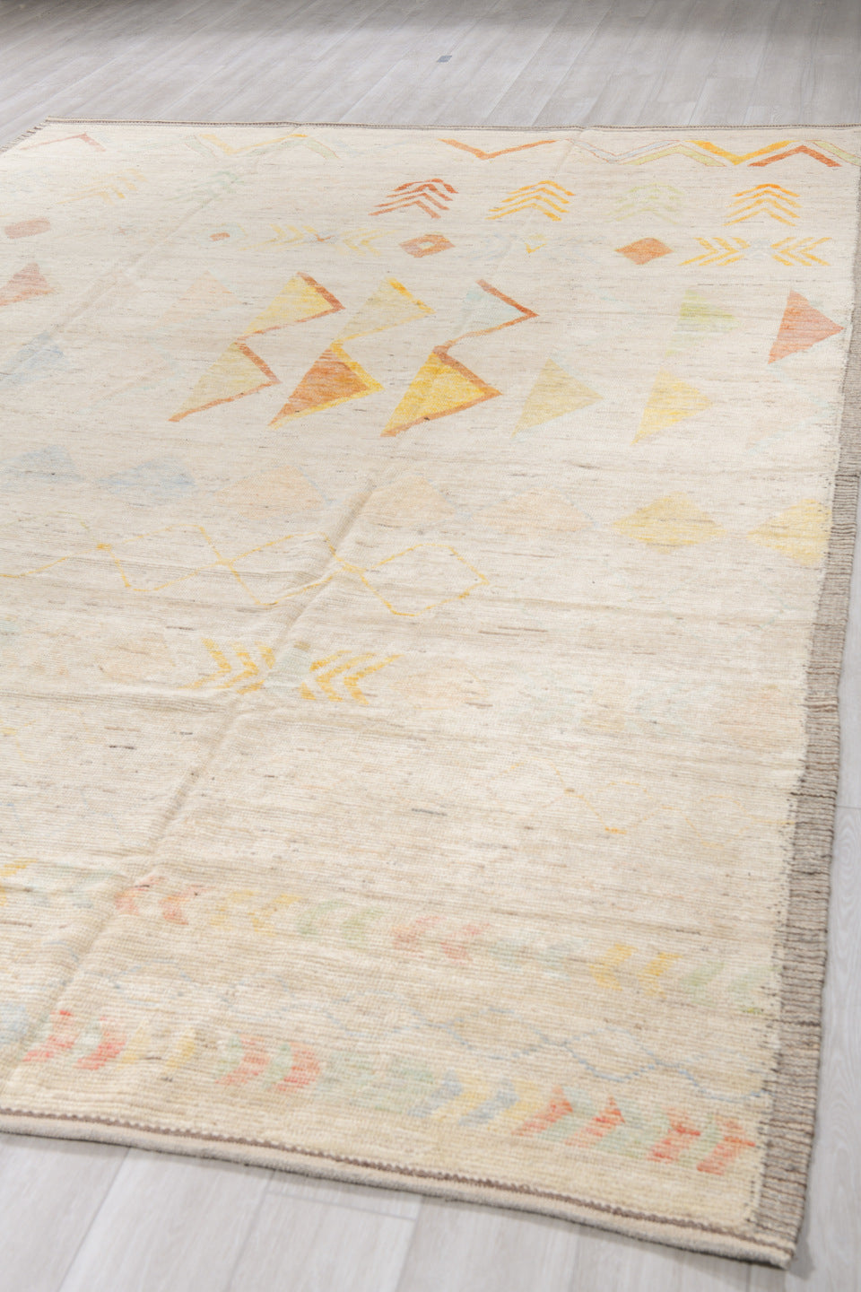 10' x 14' one-of-a-kind handmade vintage Tulu large size rug. Color palette: ivory, cream, saffron, rust, pale blue, blush